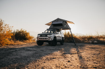 open soft shell rooftop tent installed on a Toyota hilux 