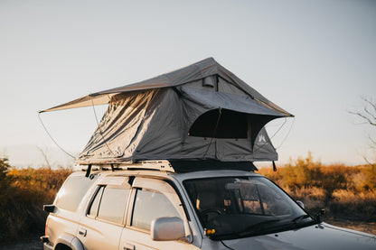 Side shot of open soft shell tent, showcasing rainfly and windows