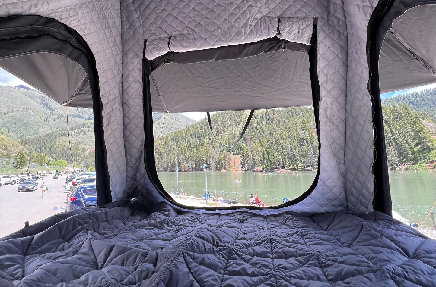 Removable insulation that zips in and out and full coverage rain fly seen from inside the rooftoptent